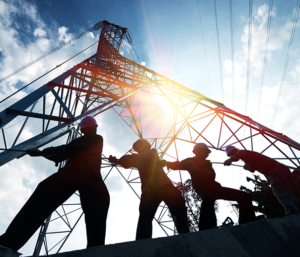 Electrical workers under electrical tower