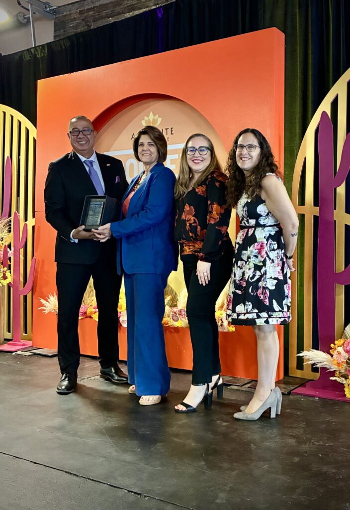 Delta Dental of Arizona Foundation executive director Barb Kozuh with team member Espie Jauregui-Echeveste and Foundation board member Jessica Yanow, who is also CEO of the Arizona Alliance of Community Health Centers, accepting the Legacy of Care honor from Pedro Cons, chief executive officer of Adelante Healthcare, during the annual luncheon. (courtesy of Adelante Healthcare)